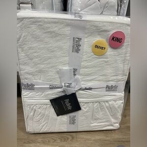 Queen sized white cotton duvet with ruffle.  2 pillow shams with ruffled edges.